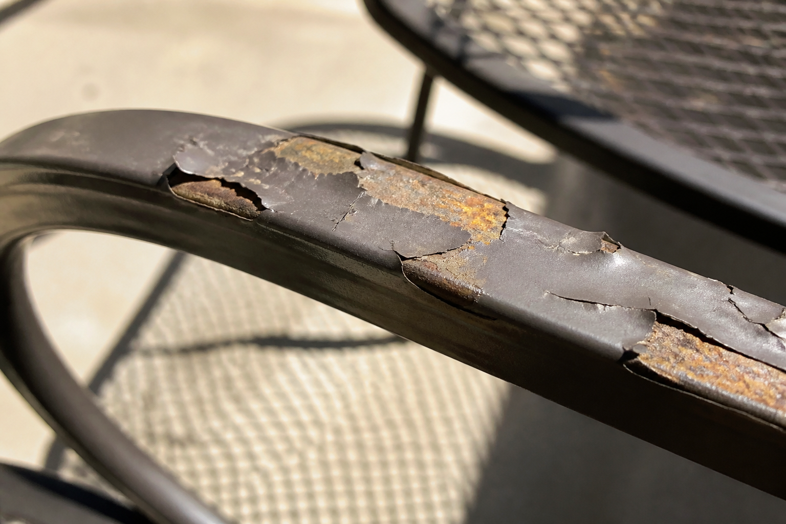 Hanamint Repair Challenges: 5 Critical Solutions for... 3 Addressing Hanamint Repair Challenges on a patio chair with peeling paint and worn fabric